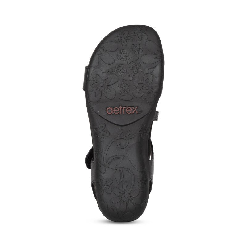 Aetrex Jess casual sandals, black with floral-embossed sole and adjustable straps.