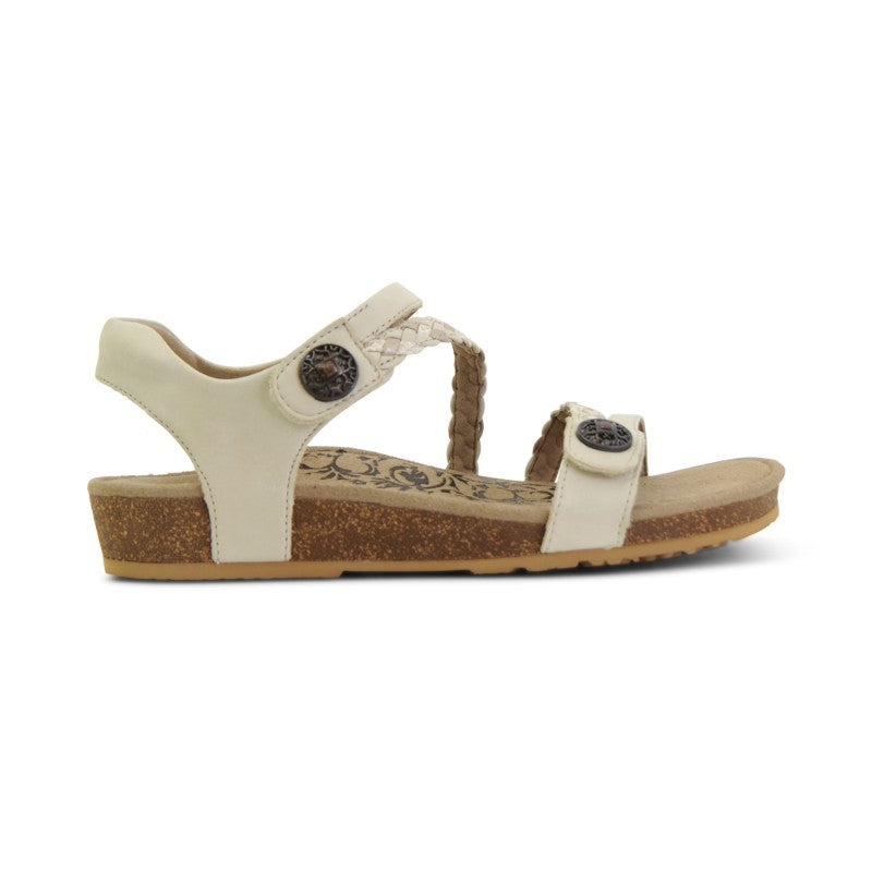 Aetrex Jillian casual sandals in cream leather with cork footbed and braided strap detail.