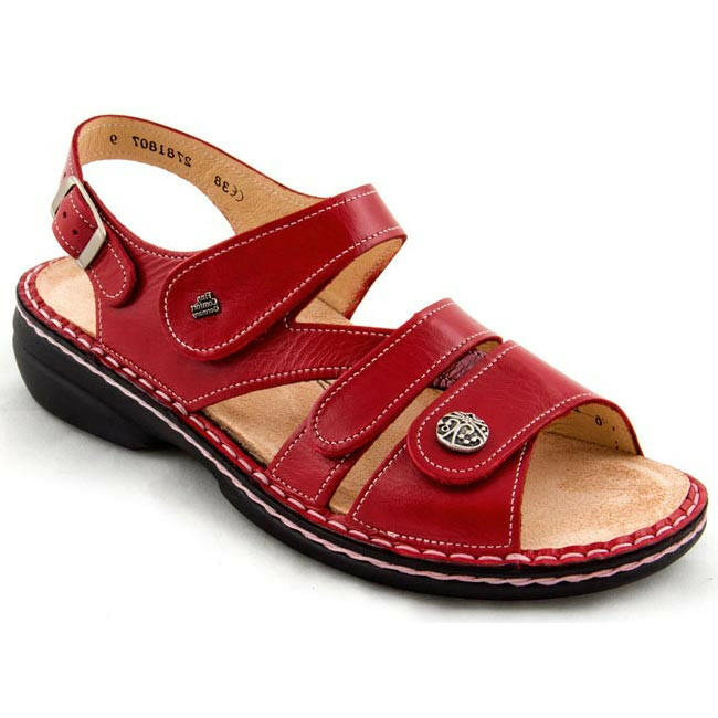 Finn Comfort Gomera-S casual sandals in red with Velcro straps and cushioned beige footbed.