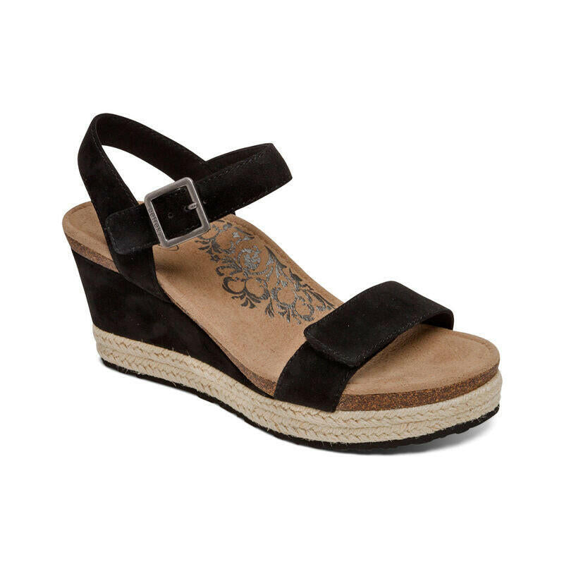 Aetrex Sydney women's casual wedge sandal in black suede with ankle strap and buckle.