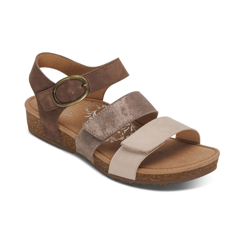 Aetrex Lilly sandals with three neutral straps (beige, taupe metallic, brown) and cork wedge.