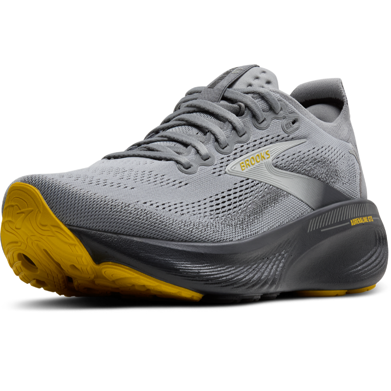 Athletic Brooks Adrenaline GTS 25 gray running shoe with yellow outsole and breathable mesh upper