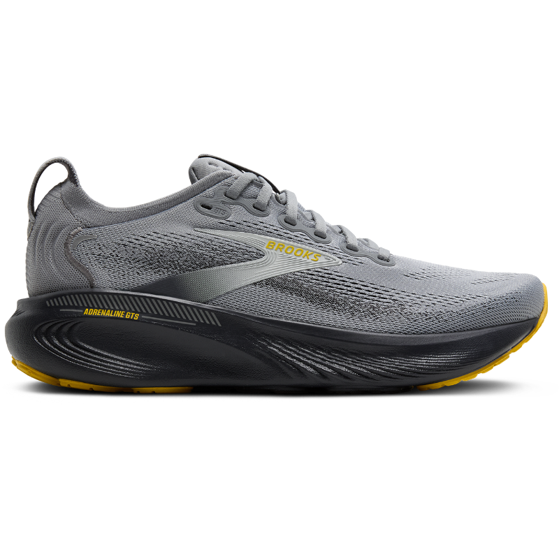Brooks Adrenaline GTS 25 athletic shoes in gray mesh with black midsole and yellow accents.