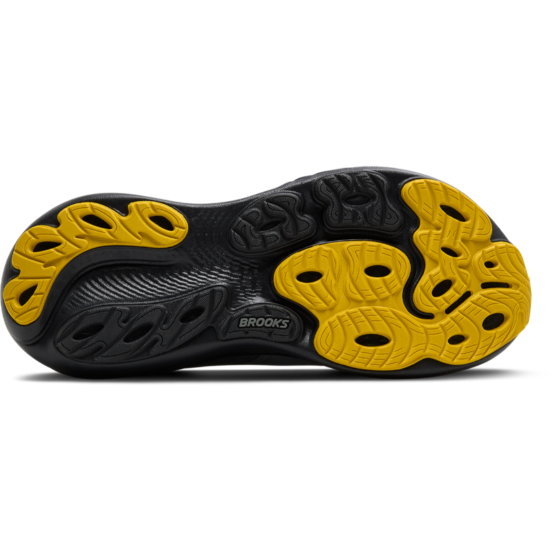 Brooks Adrenaline GTS 25 athletic shoes with black and yellow outsole pattern and visible Brooks logo.