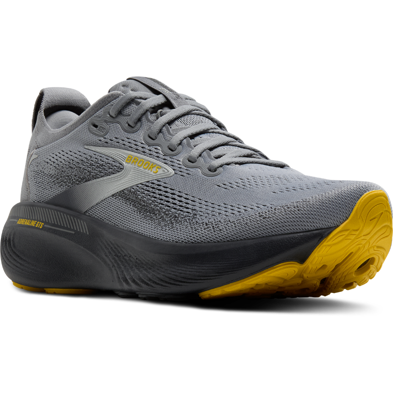 Brooks Adrenaline GTS 25 athletic shoes, grey mesh upper with yellow outsole.